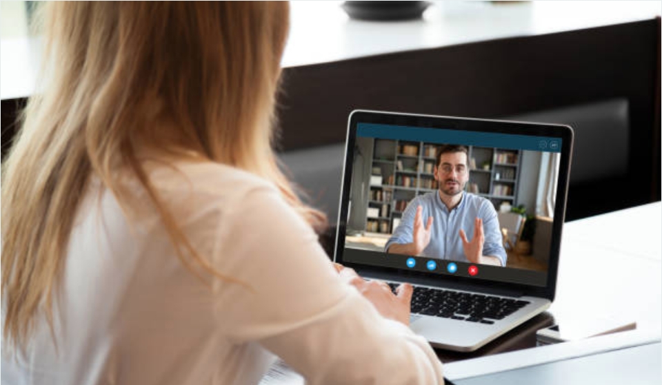 Woman in a virtual Resource Hero Office Hour meeting with a Salesforce pro.